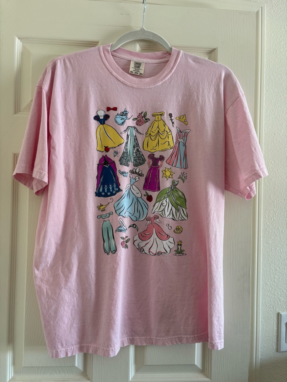 Comfort Colors Pastel Pink Short Sleeve Tee with Disney Princess Dresses.